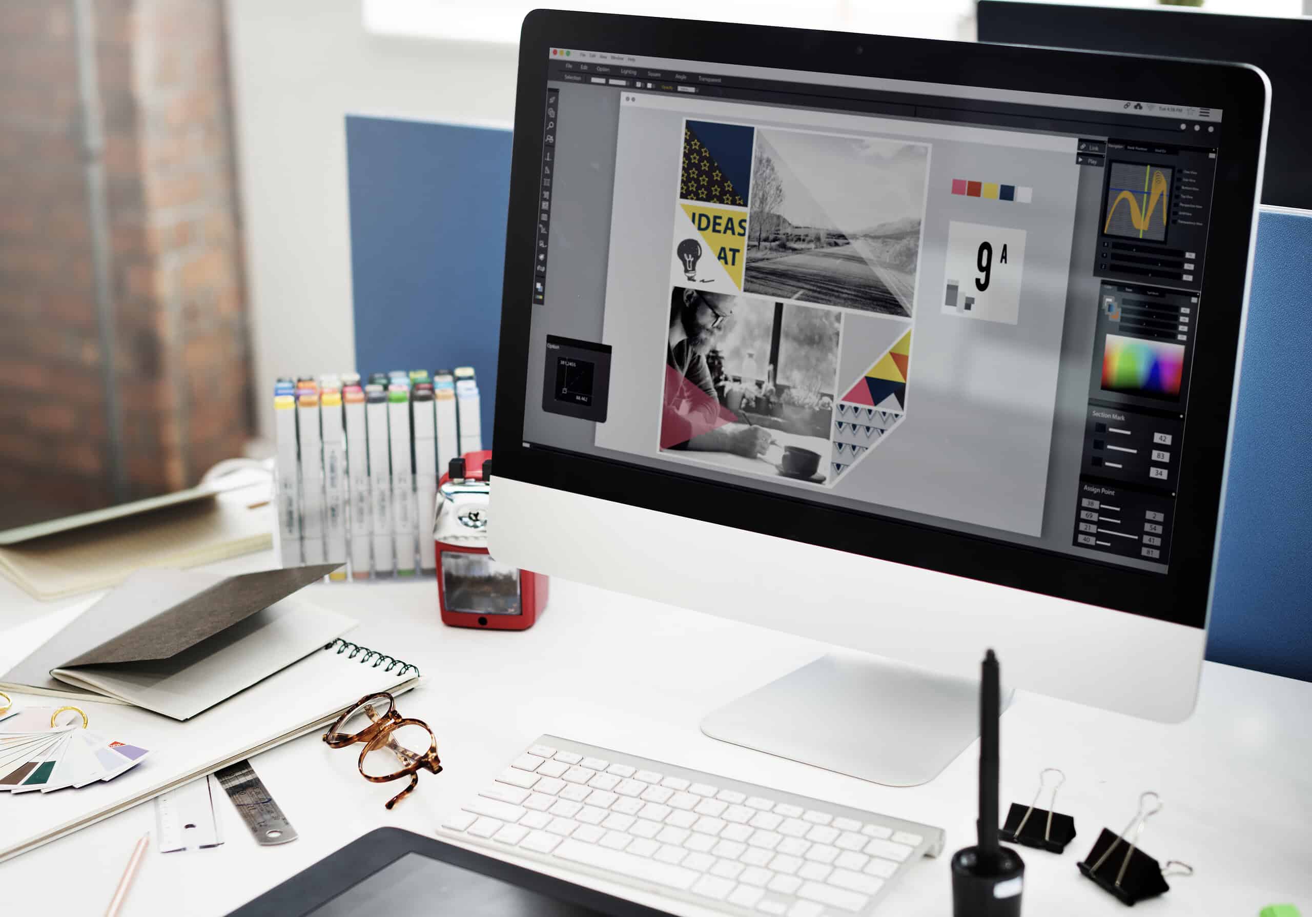 High-resolution close-up of an iMac displaying graphic design projects for marketing.